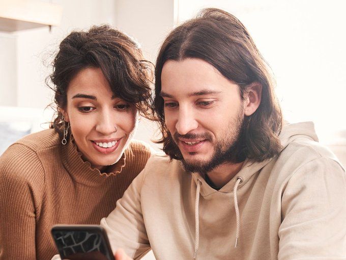 Couple joining the support group on their mobile phone