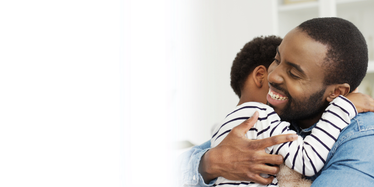 Dad and son hugging - Other services at Manchester Fertility