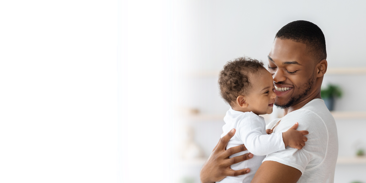 Dad and son cuddling - ZyMot Advanced Sperm Selection at Manchester Fertility