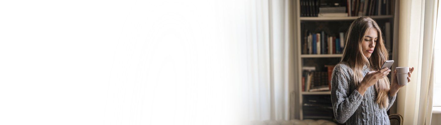 woman looking at mobile phone