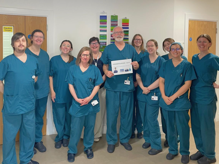 Manchester Fertility Expert Embryology team celebrating Alan Birks 33rd year with the clinic