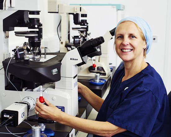 Debbie at Manchester Fertility in the clinic at a microscope