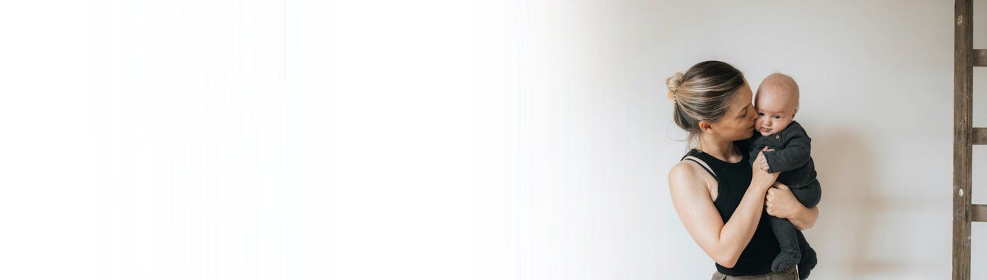 Baby looking at the camera with finger in his mouth